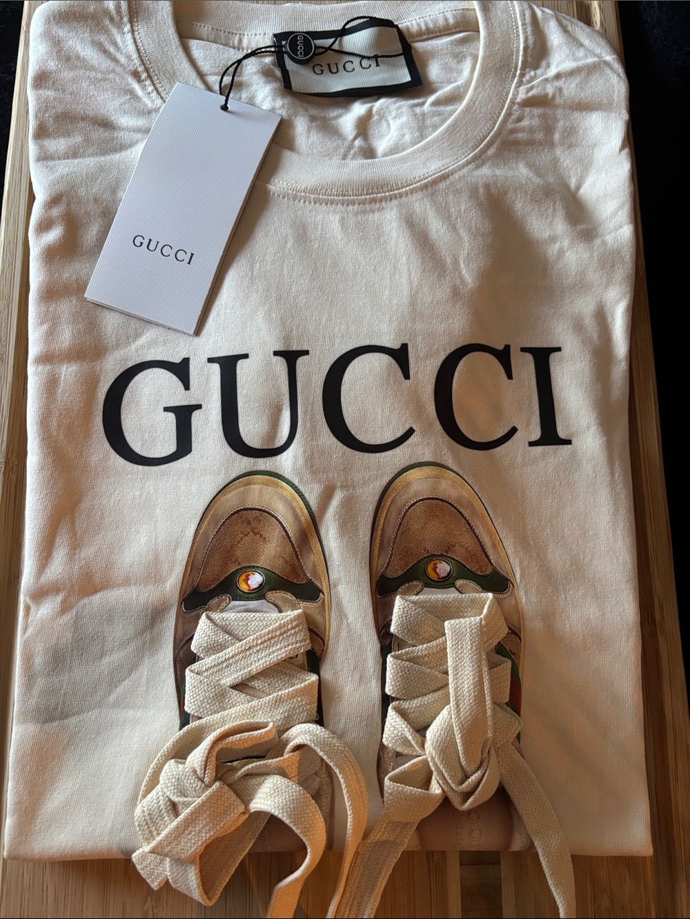 Brand New !!  Ivory Tee with Brown & Tan Sneaker Graphic read 👇